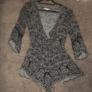 Black patterned long-sleeve romper